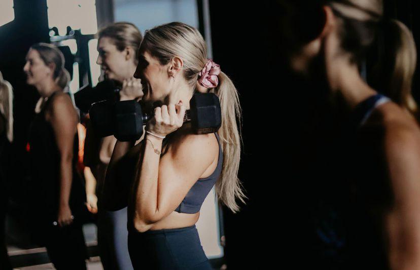 Group dumbbell class at The Fitness Cartel