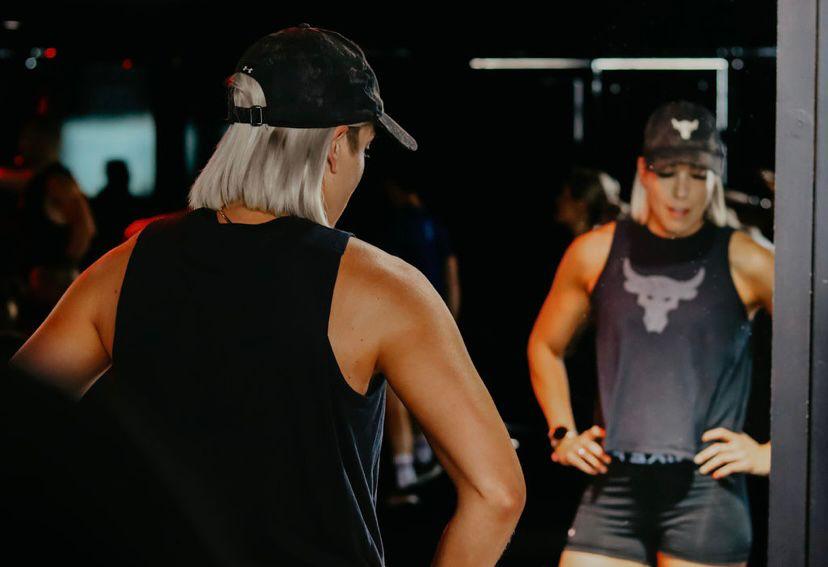 Member performing sumo squats