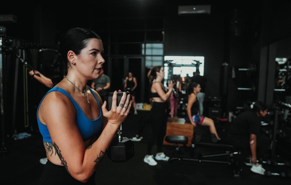 Women's group class doing squats
